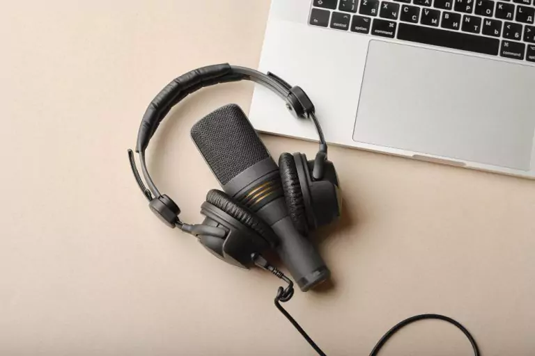 podcast microphone next to laptop